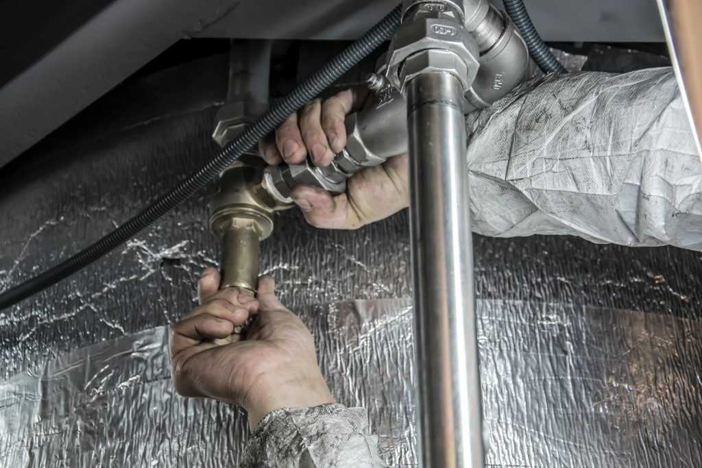 plumber west auckland fixing damaged plumbing system